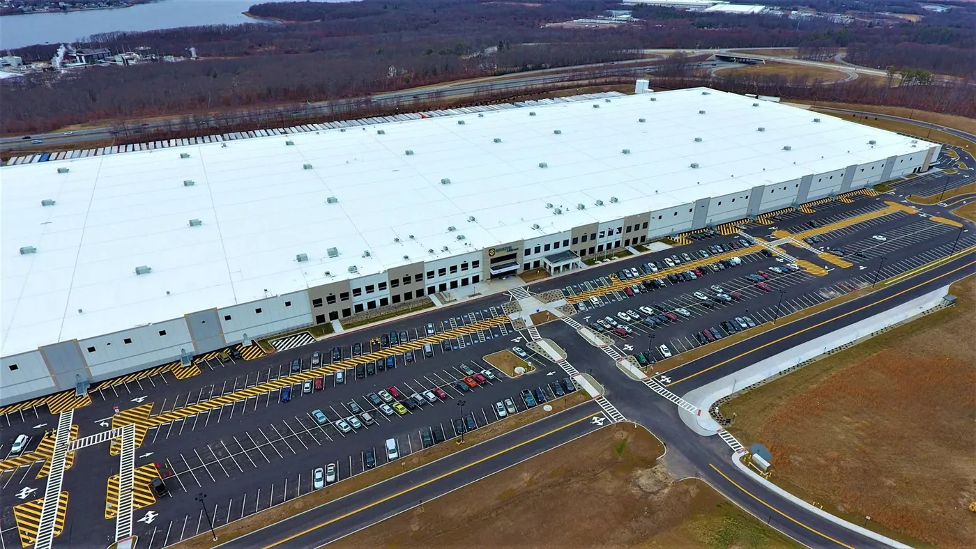 Aerial view of a large distribution center beside Route 24 in Fall River, MA